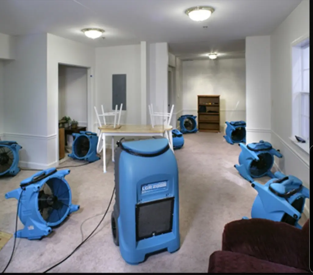 Air movers and dehumidifier setup for Water Damage Restoration in Raynham
